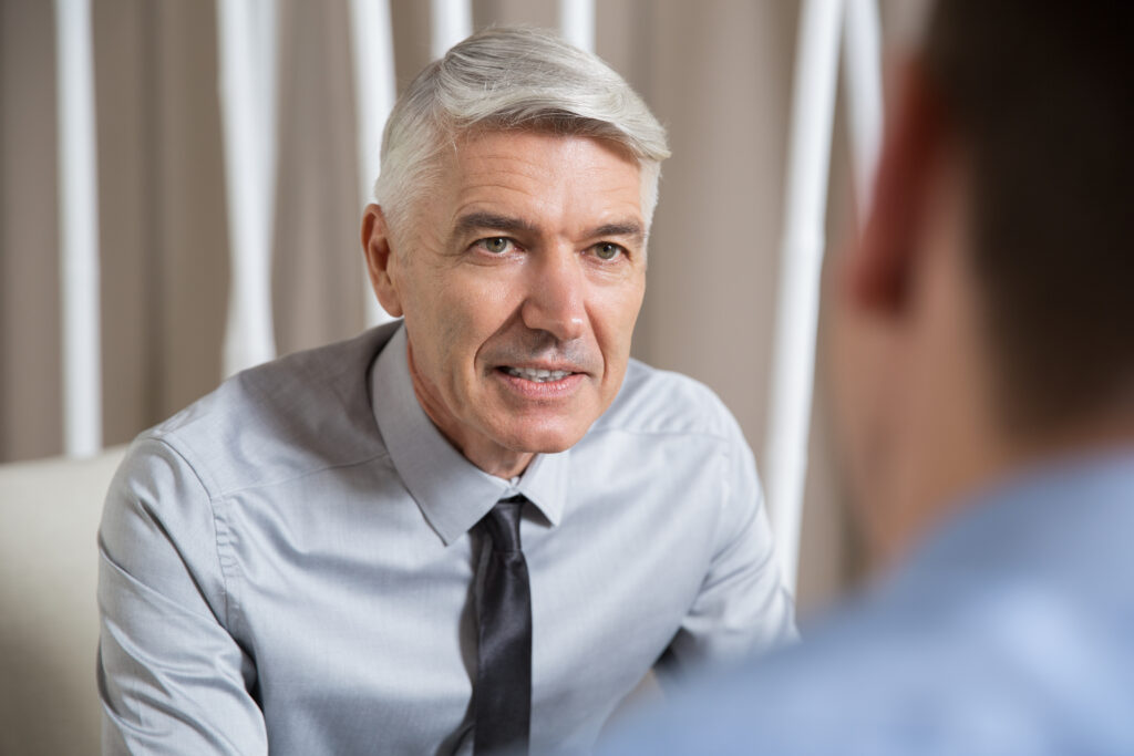successful senior businessman talking partner